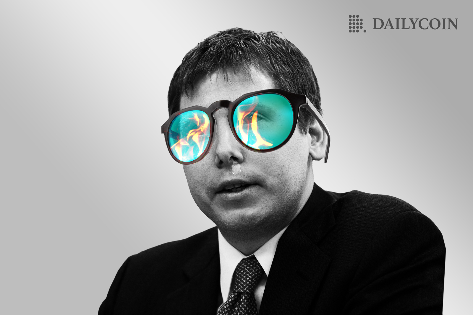 A man in a suit with huge glasses cover almost all of his face