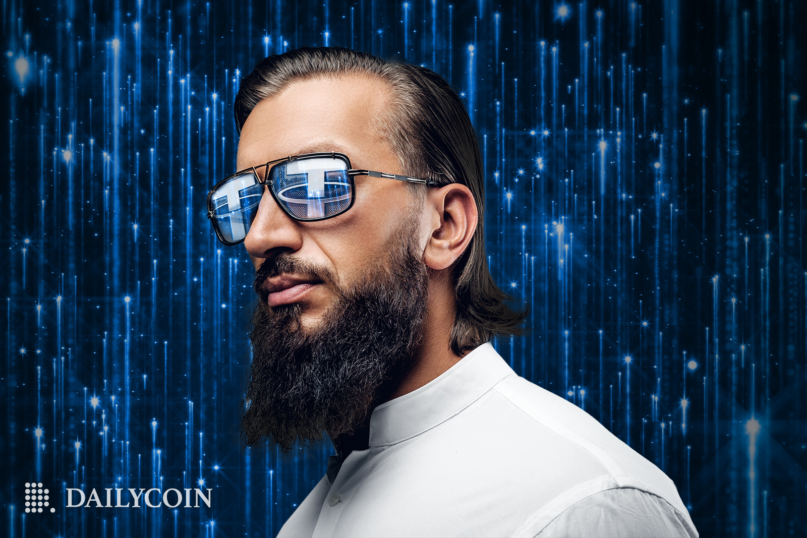 A man with a beard wearing glasses with blue Tether logo.