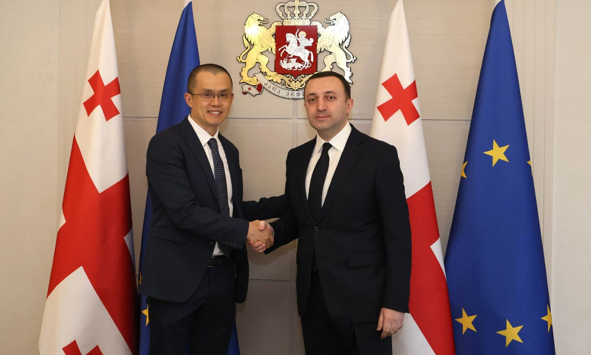 Binance CEO Changpeng Zhao (left) and Georgian Prime Minister Irakli Garibashvili shaking hands.