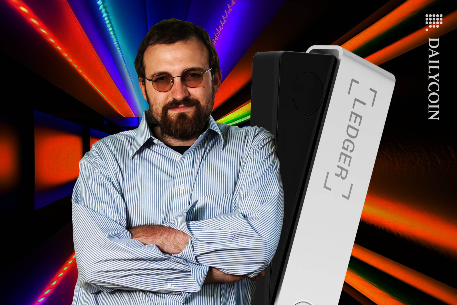 Charles Hoskinson leaning on a Ledger Nano.