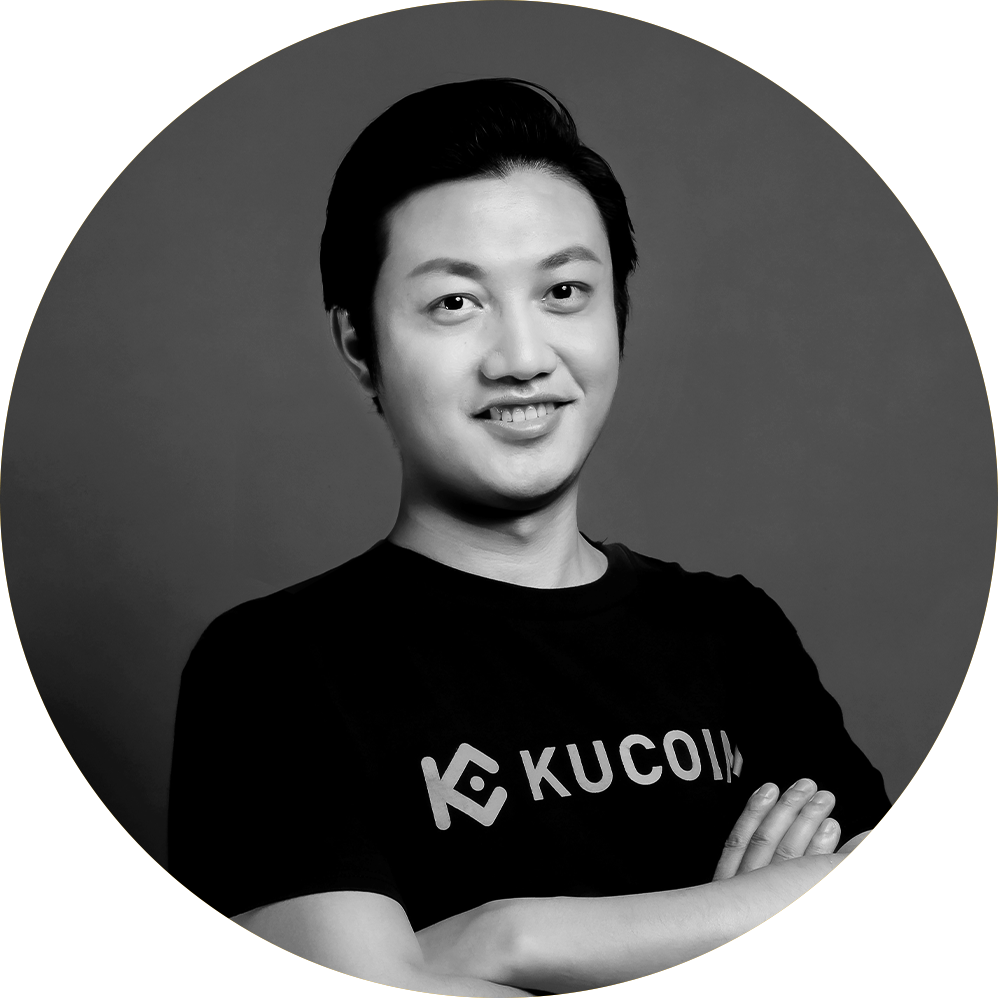 Johnny Lyu in black and white standing with his hand folded over his body.