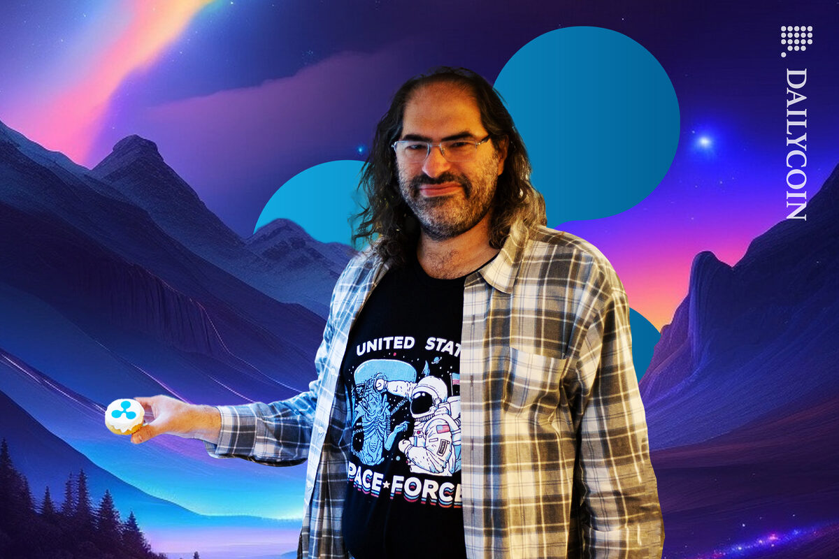 David Schwartz holding a Ripple cupcake in Ripple land.