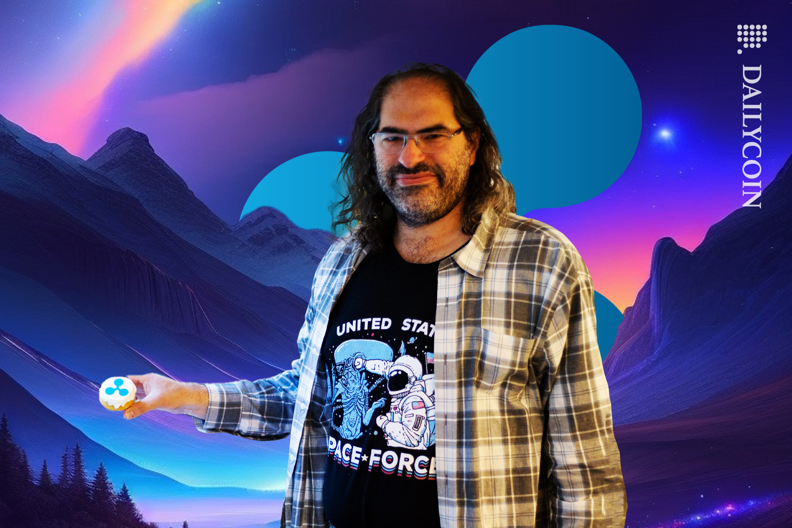 David Schwartz holding a Ripple cupcake in Ripple land.