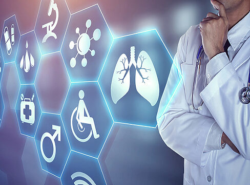 doctor staring at informative panels.