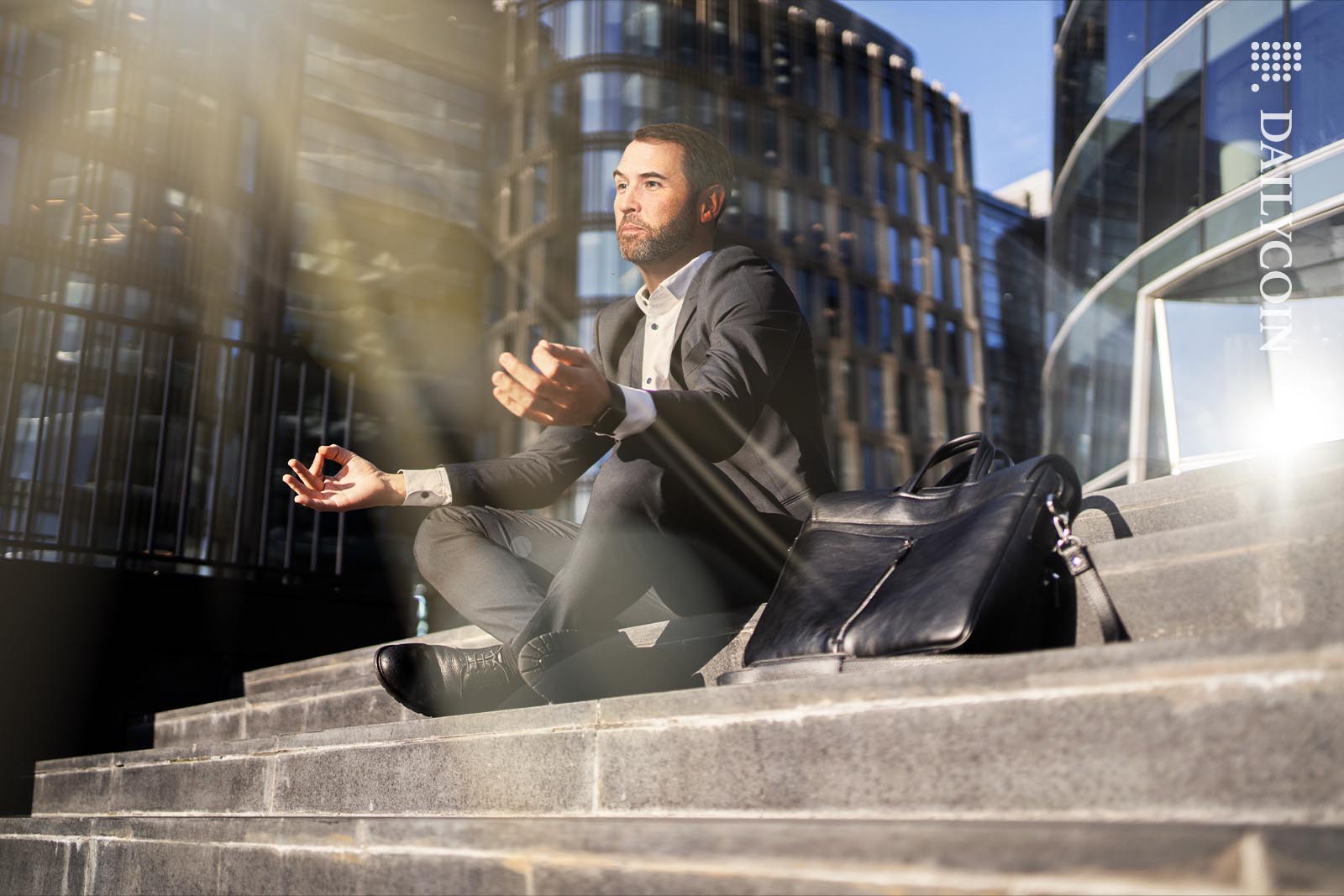 Ripple CEO Brad Garlinghouse sitting on the stairs of a courthouse meditating for the XRP vs SEC case completion.