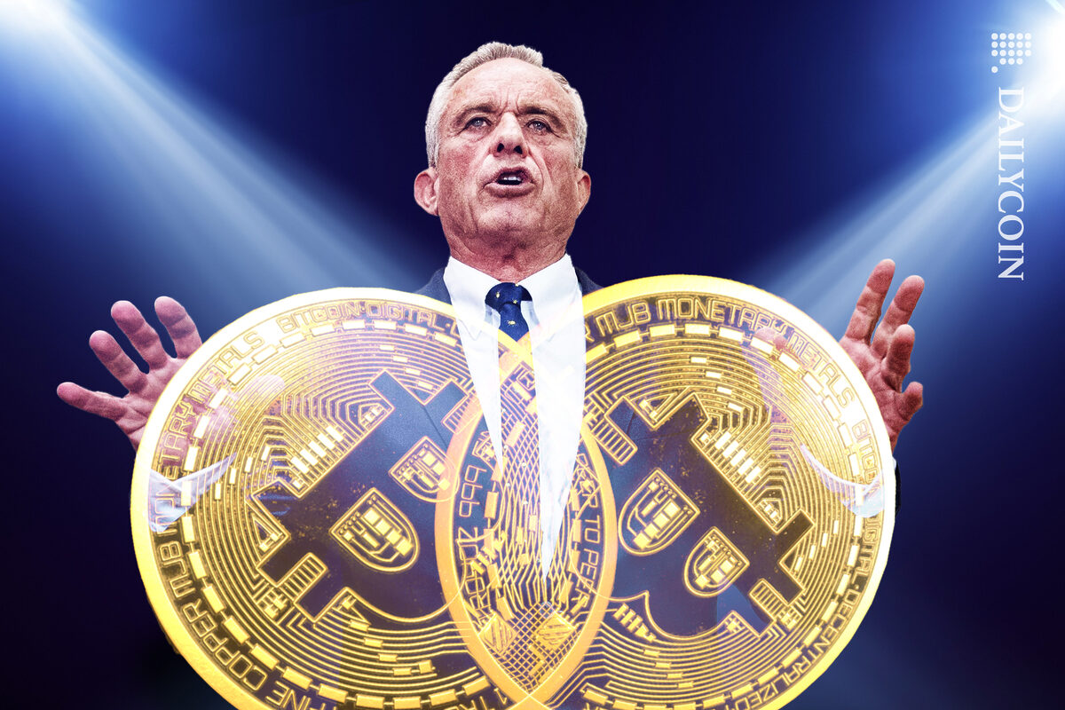 Robert F. Kennedy Jr. holding two Bitcoins.