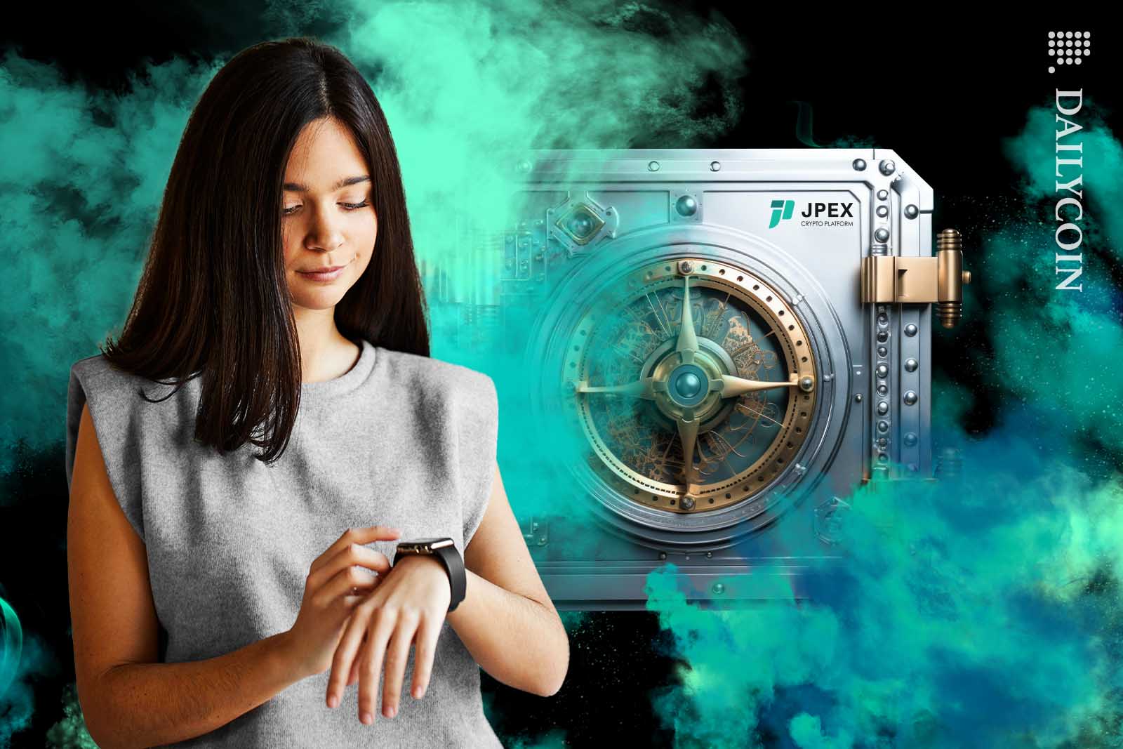 Young woman looking at her watch wandering when she can access her assets from the vault behind her.
