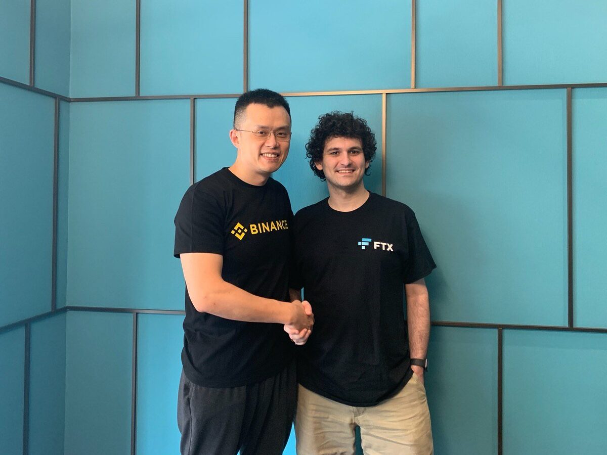 Picture of CZ and SBF shaking hands.