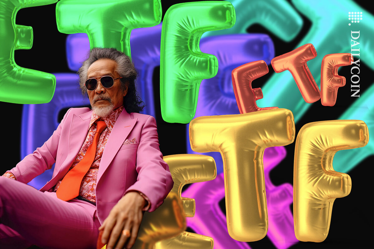 Rich asian man in a pink suit sitting confidently surrounded by colourful baloon letters.