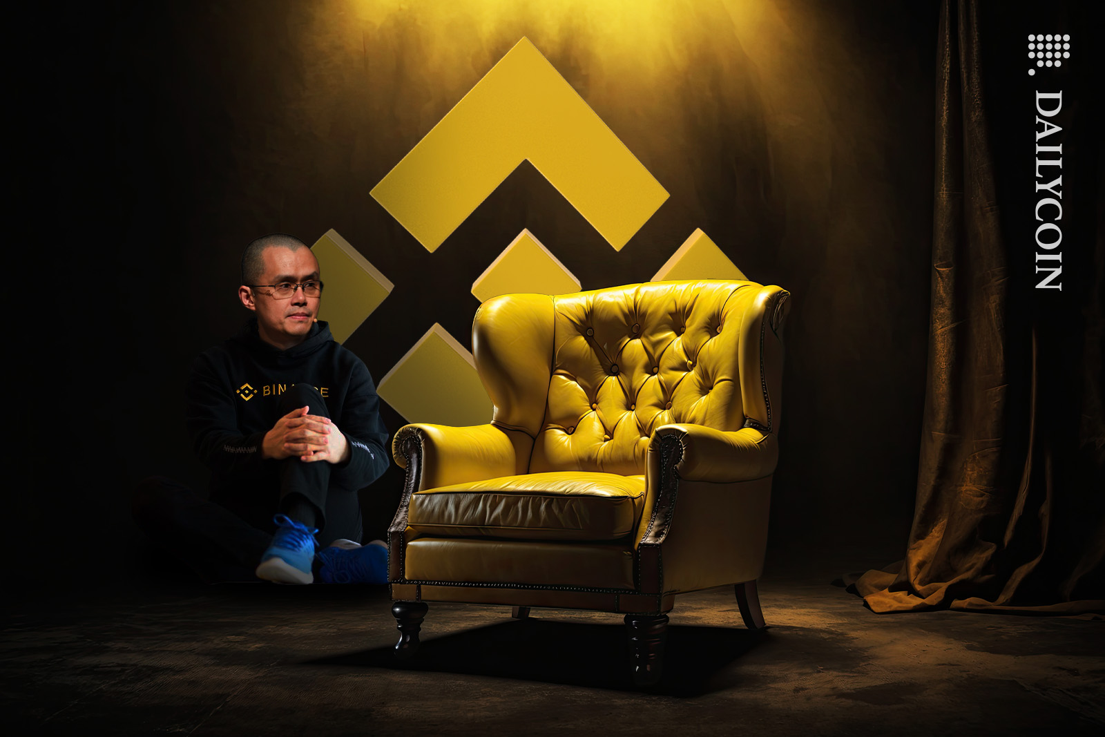 Changpeng Zhao sitting on the floor near the Binance Chairman's throne.
