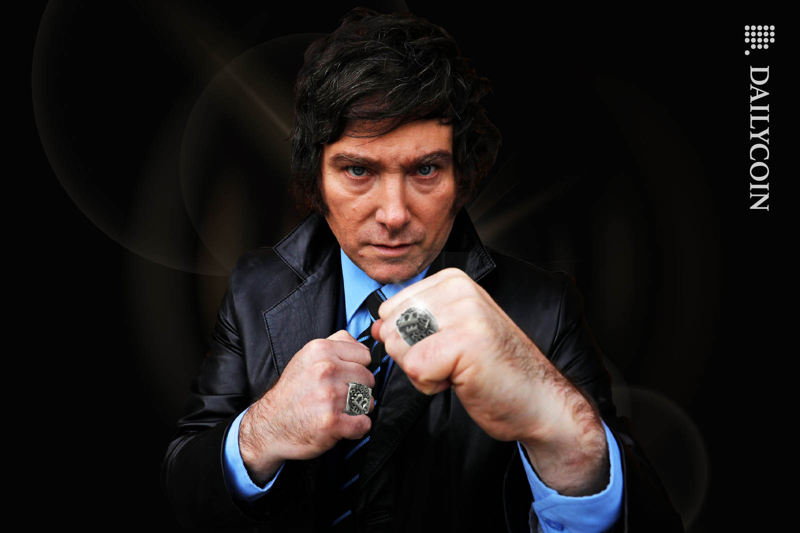 Javier Milei airboxing into the camera, with Bitcoin rings on his fingers.