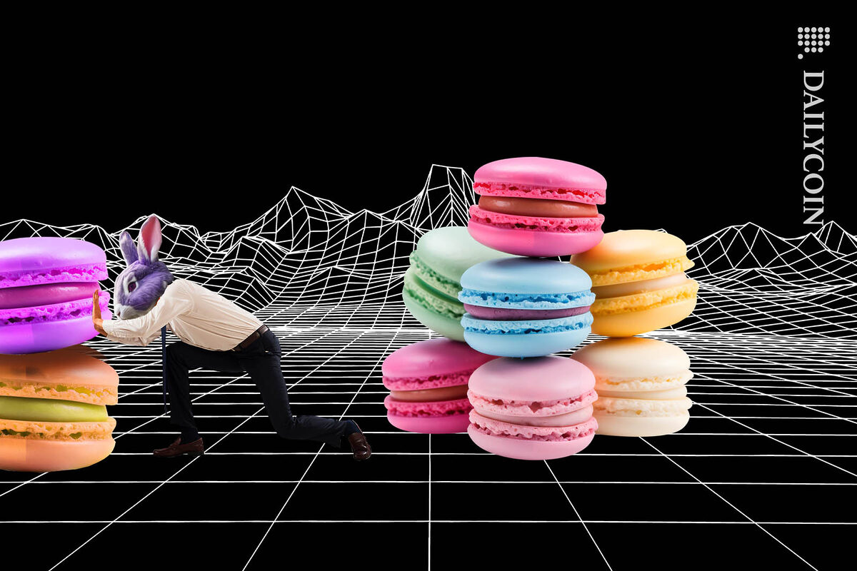 Man in rabbit mask pushing away 2 macaroons from a large pile.