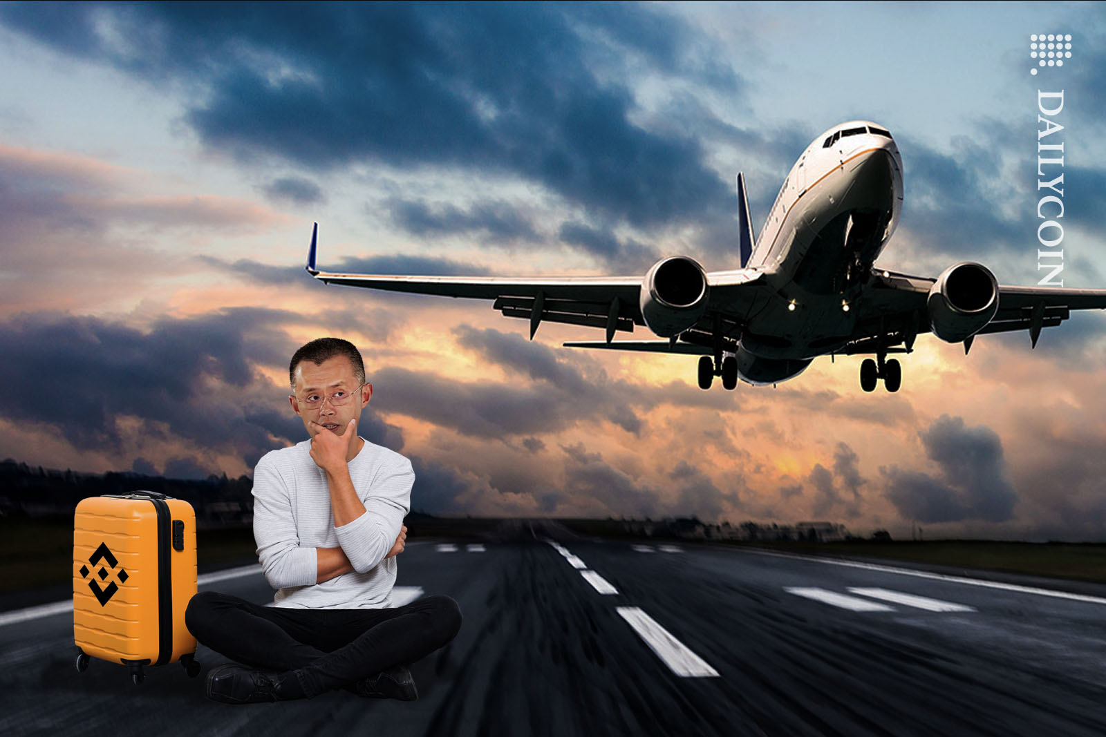 Changpeng Zhao of Binance sitting on a runway watching an aeroplane taking off.