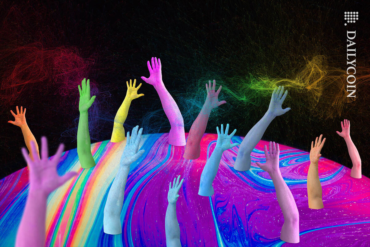 Lots of colourful hands reaching out to catch some colourful particles in the air.