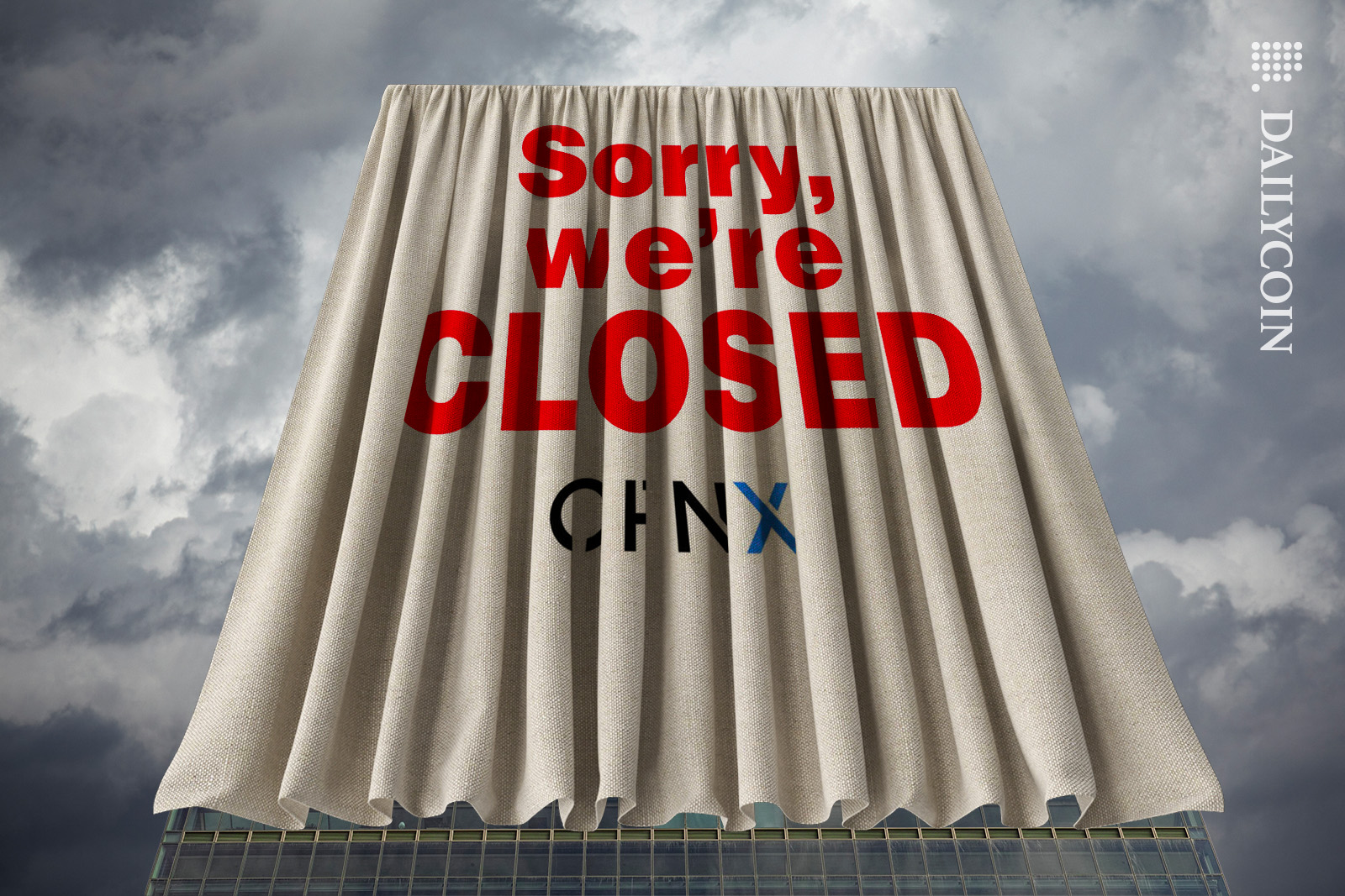 OPNX building covered in a cloth with a sign, sorry we're closed.