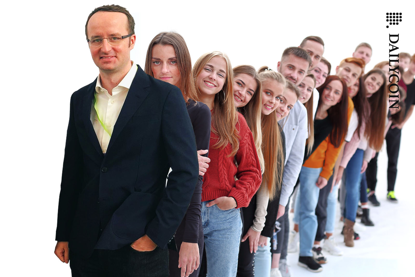 Kris Marszalek looking happy with a large group of young people behind him.