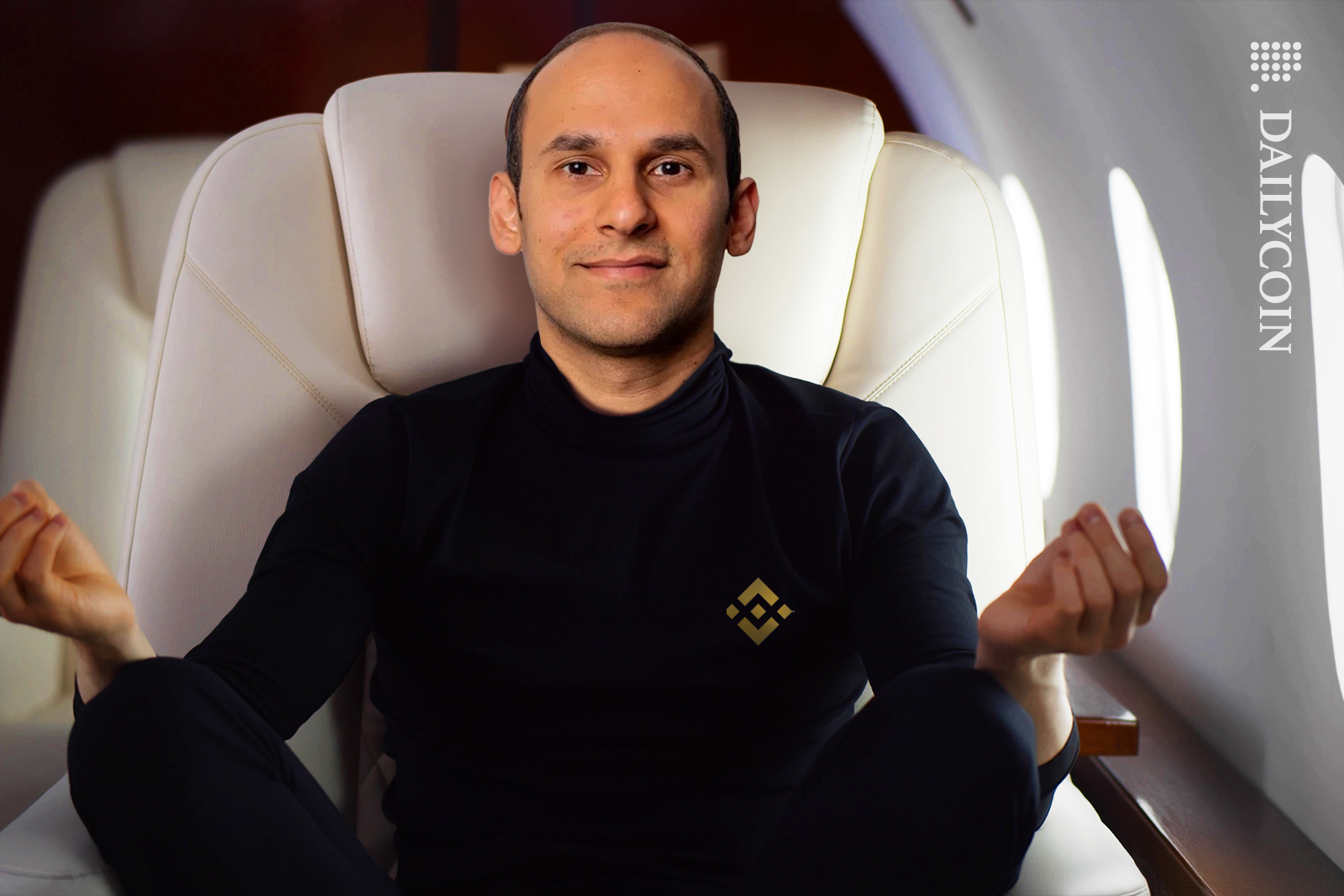 Nadeem Anjarwalla of Binance casually meditating on an airplane.