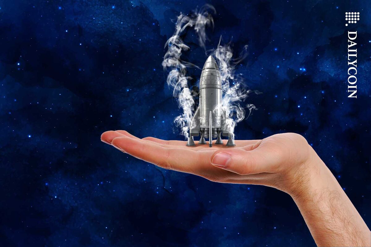 Little rocked on human hand being ready to be launched.