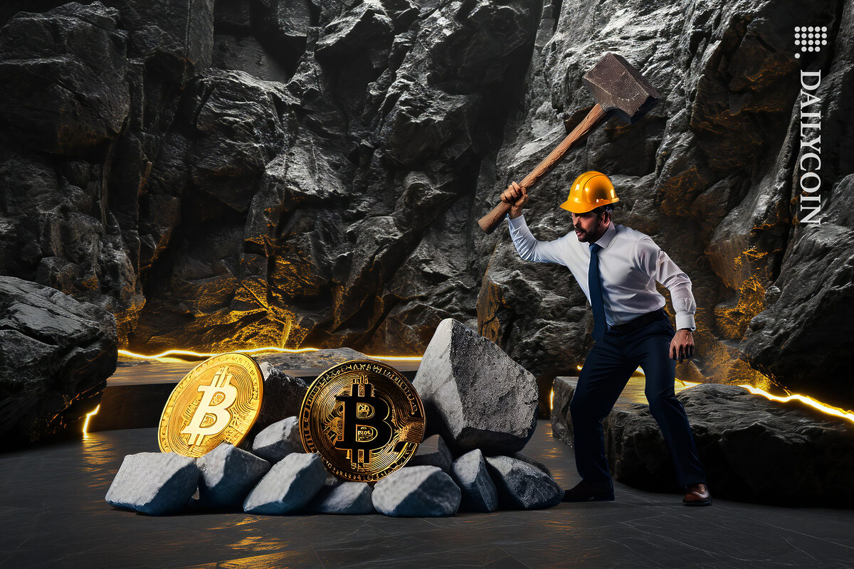 Guy cracking bitcoin rocks in a cave.