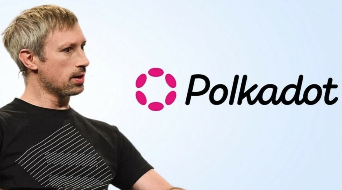 Gavin Wood speaking in a conference, with the word "Polkadot" in the background.