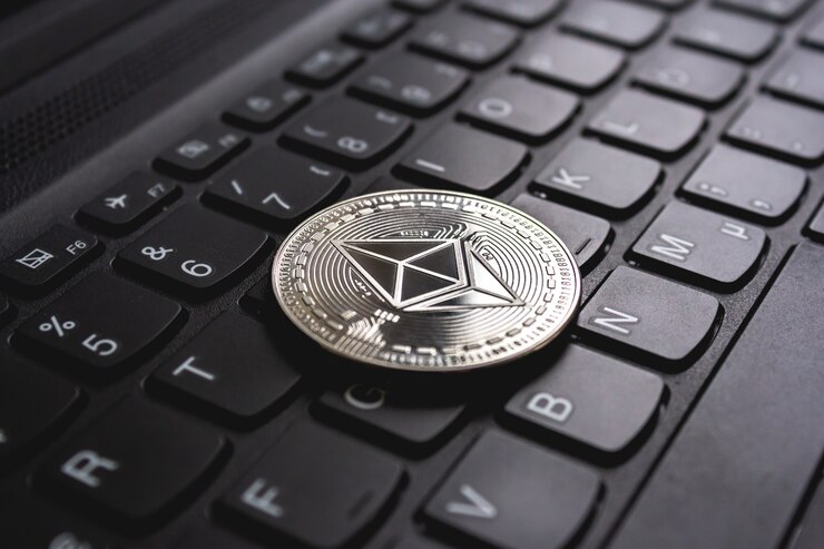 Ethereum token placed on a keyboard.