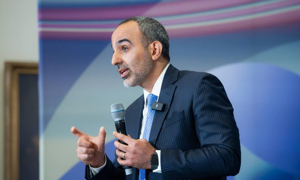 A man giving presentation at a conference.