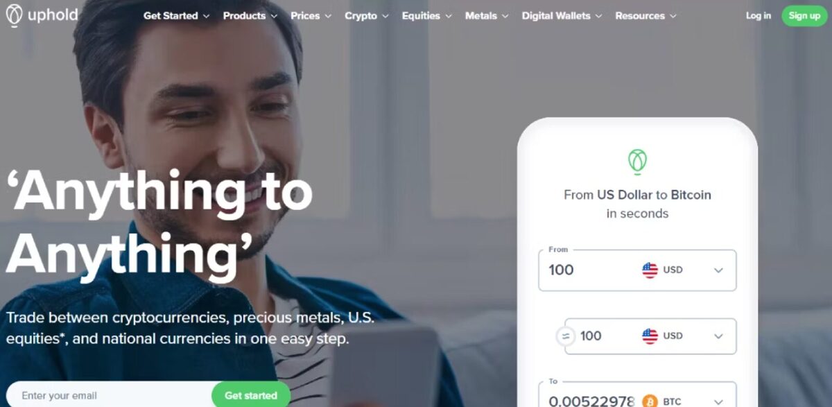 A man looking at his phone with the slog 'Anything to Anything' in the foreground. Underneath is an explanation that Uphold allows for trade between crypto, precious metals, and U.S equities.
