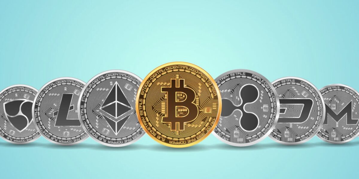 Bitcoin token in gold with other tokens, including Ethereum and Litecoin, standing to the side of it.
