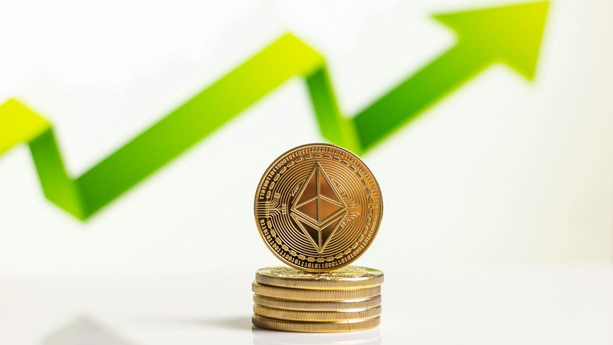 Ethereum tokens stacked in front of a green arrow going up.