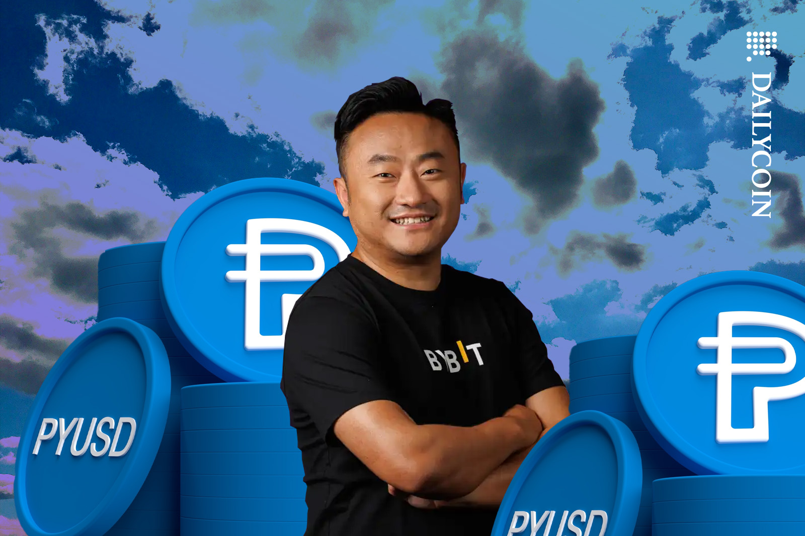 Ben Zhao of ByBit posing between piles of PYUSD coins.