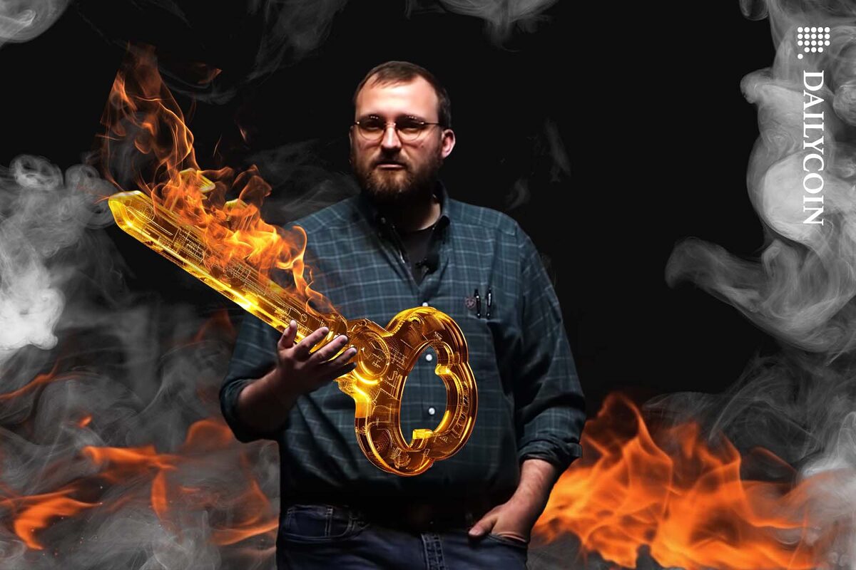 Charles Hoskinson holding a burning key.
