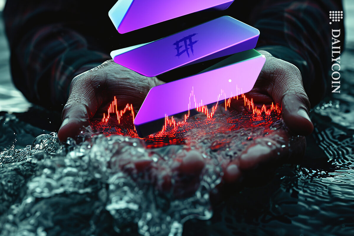 Hands holding a small chart of SOL ETF from the spring.