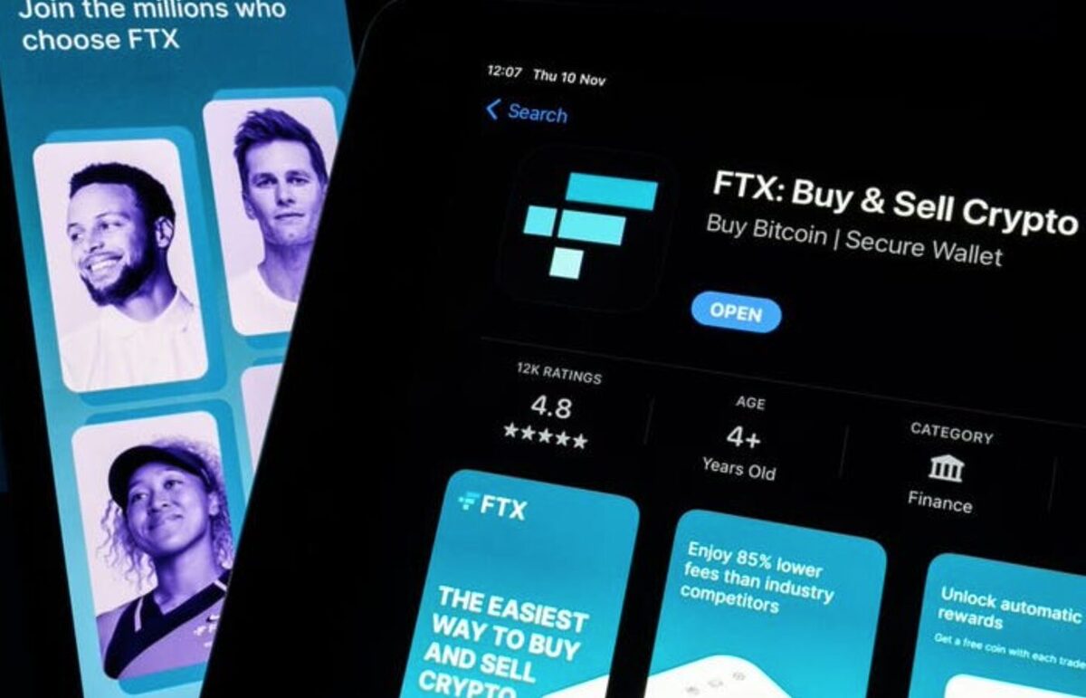 FTX advertisement showing the faces of Tom Brady and Naomi Osaka in the background. At the foreground is an image of FTX as a mobile app.