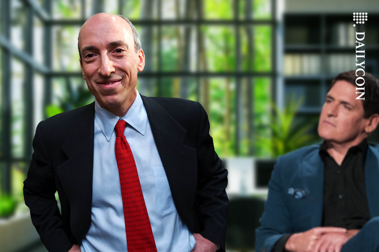 Gary Gensler in the forefront smiling, as Mark Cuban sits in the background.