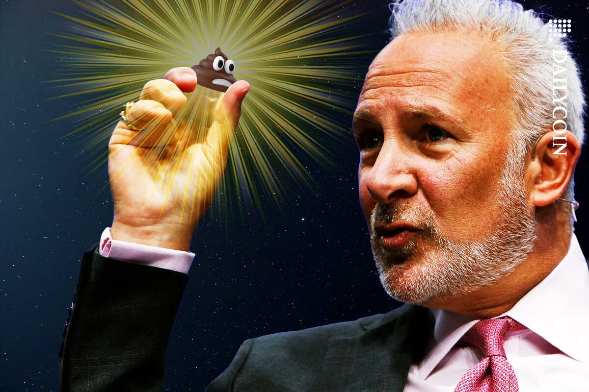 Peter Schiff holding up a poop emoji as he is explaining something.