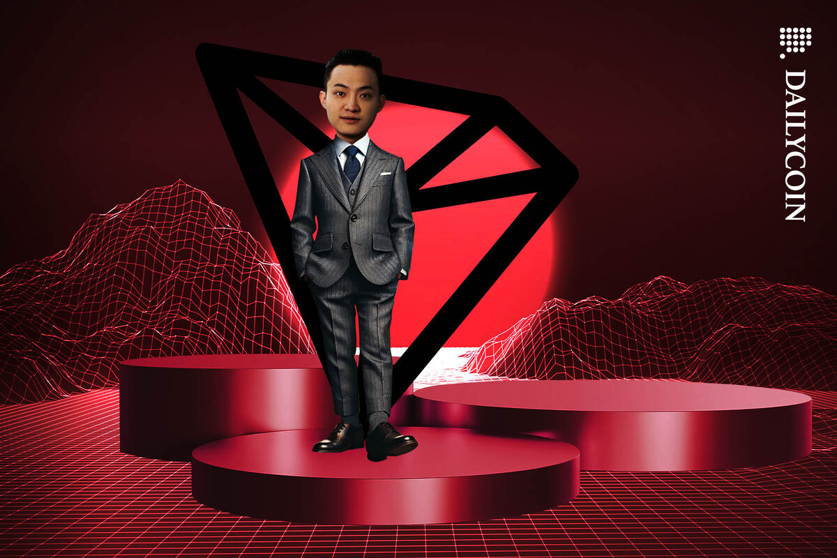 Justin Sun standing confidently on a podium with a big TRON logo behind him.