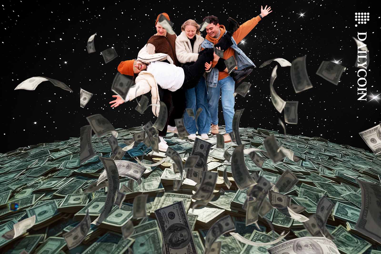 Group of friends celebrating on a pile of money.