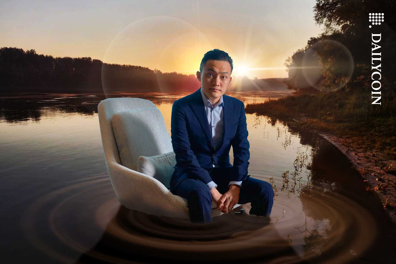 Justin Sun sitting in the Danube on an office chair.