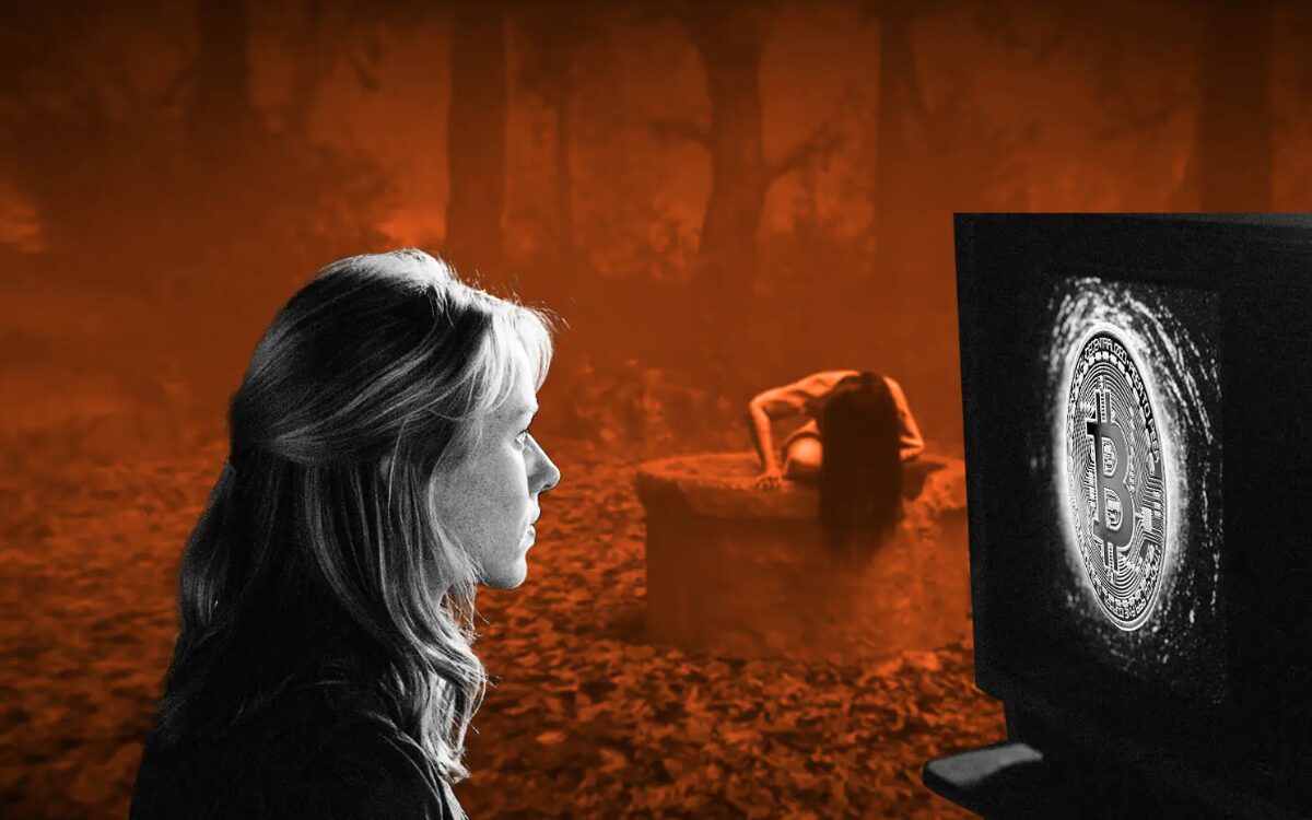 A woman sat alone in the woods looking at a Bitcoin symbol on a screen while the Grudge crawls out of a hole in the background.