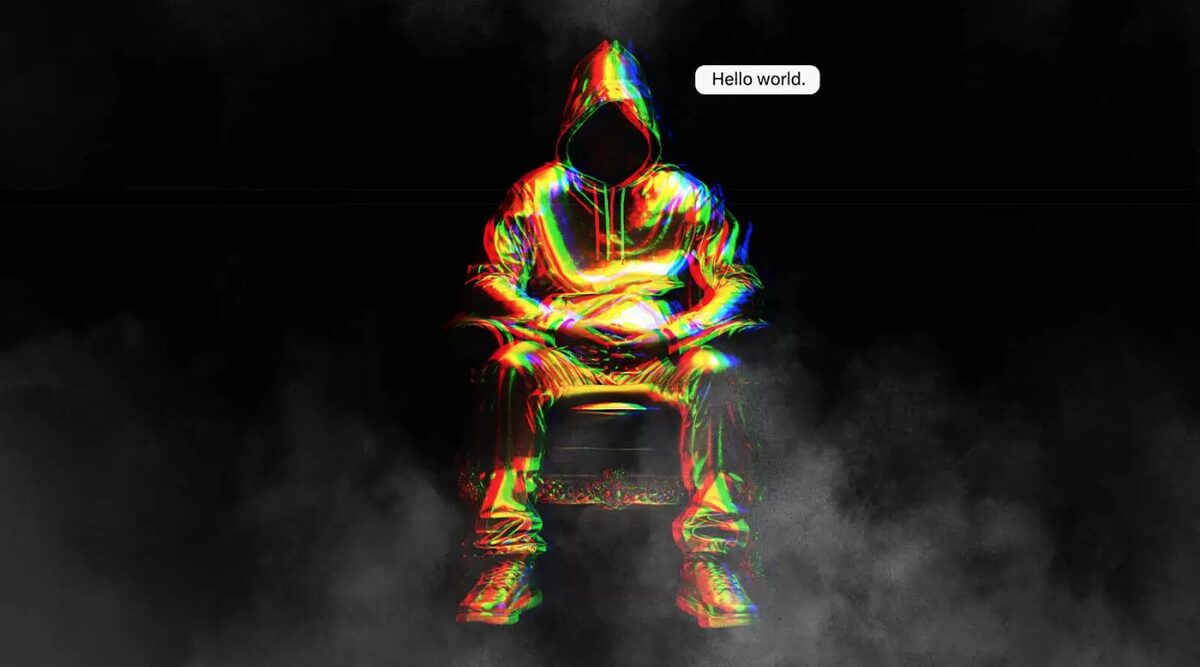 A man in a hoodie who appears distorted with a speech bubble saying "Hello world".