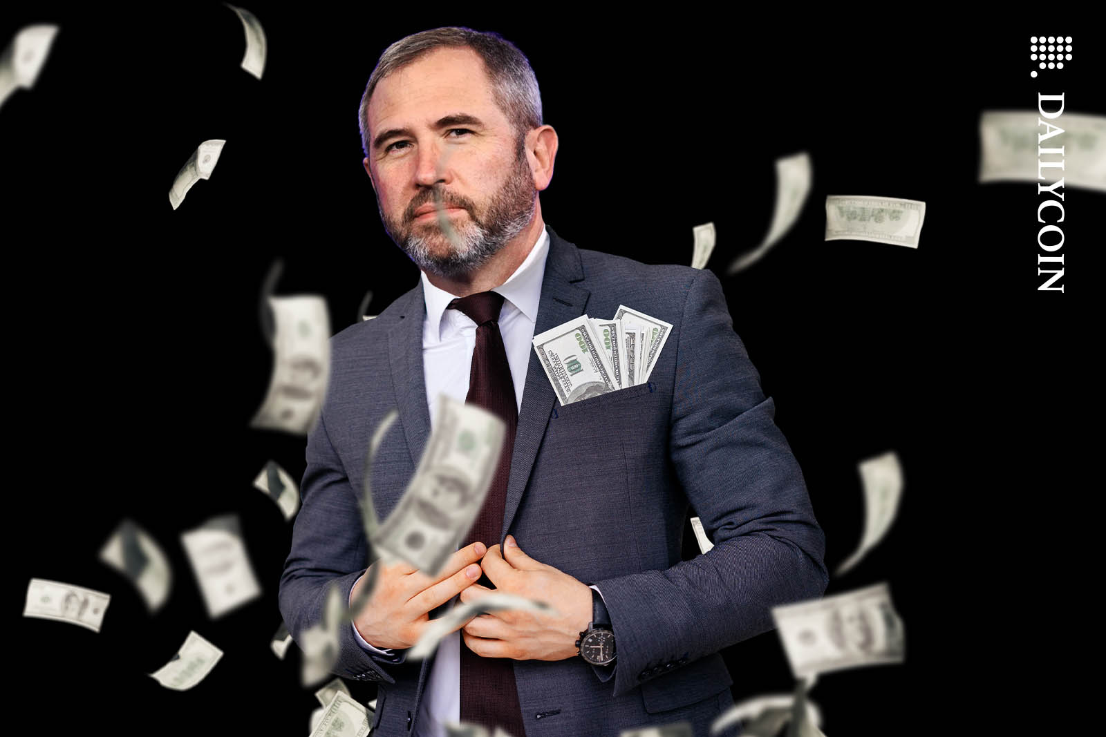 Brad Garlinghouse posing with money in his pocket.